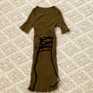 Green corseted looking dress cinching the waist.